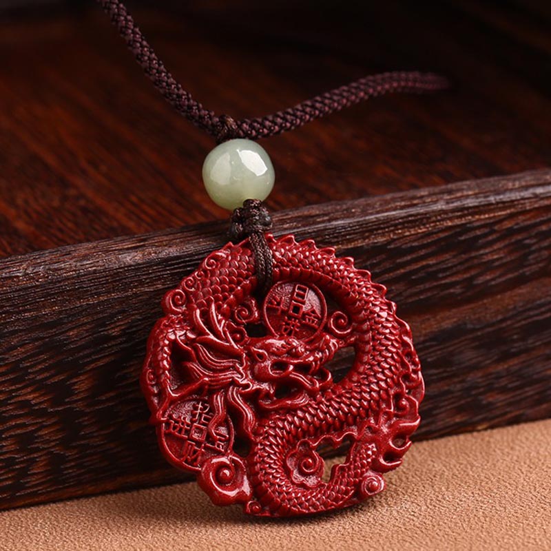 Cinnabar Hetian Jade Dragon Necklace - dragon pendant with prosperity symbols on rustic wood