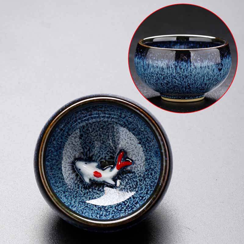 Jianzhan Koi Teacup – dramatic lighting highlighting glaze depth, jianzhan pottery