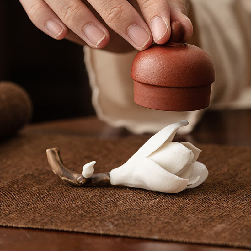 Gardenia Ceramic Incense Burner – Teapot lid resting on white flower, brown woven mat, tea ceremony accessory