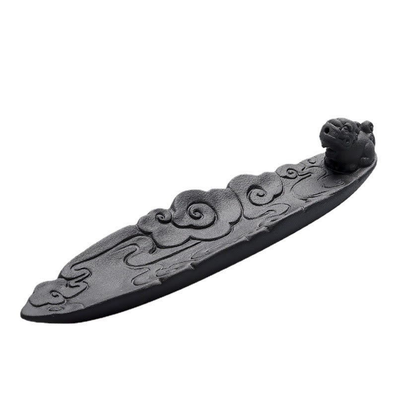 Auspicious Clouds Pixiu incense burner, three-quarter elevated view, ruyi cloud carvings, guardian beast finial – dark ceramic stick holder