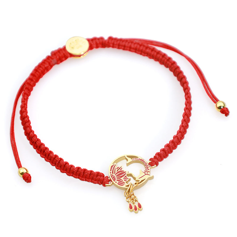 Tibetan Red String Koi Fish Bracelet – red cord on white background, gold koi fish charm with adjustable sliding knot