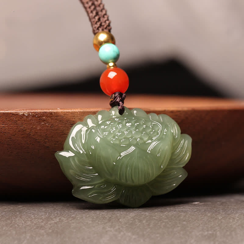 Hetian Jade Lotus Necklace – blooming lotus pendant on wood display, success and harmony talisman