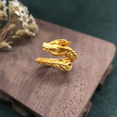 Golden Dragon Success Strength Ring - detailed dragon head profile with horn crest, gold matte finish