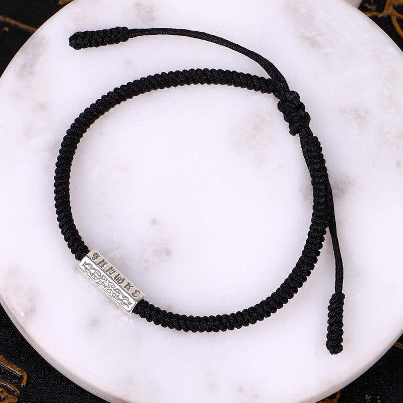 Red String Om Mani Padme Hum Bracelet - Black cord variant on white marble, black bracelet