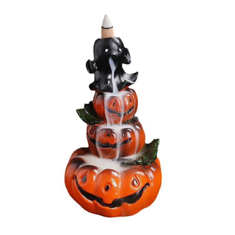 Pumpkin ghost backflow incense burner on white background, smoke cascading through three jack-o-lantern tiers, green leaves – Halloween smoke fountain