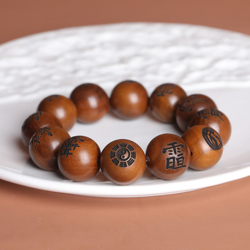 Lightning Struck Jujube Wood Taoist Bracelet - Wood prayer bracelet on white plate with Bagua engraving, carved wooden jewelry