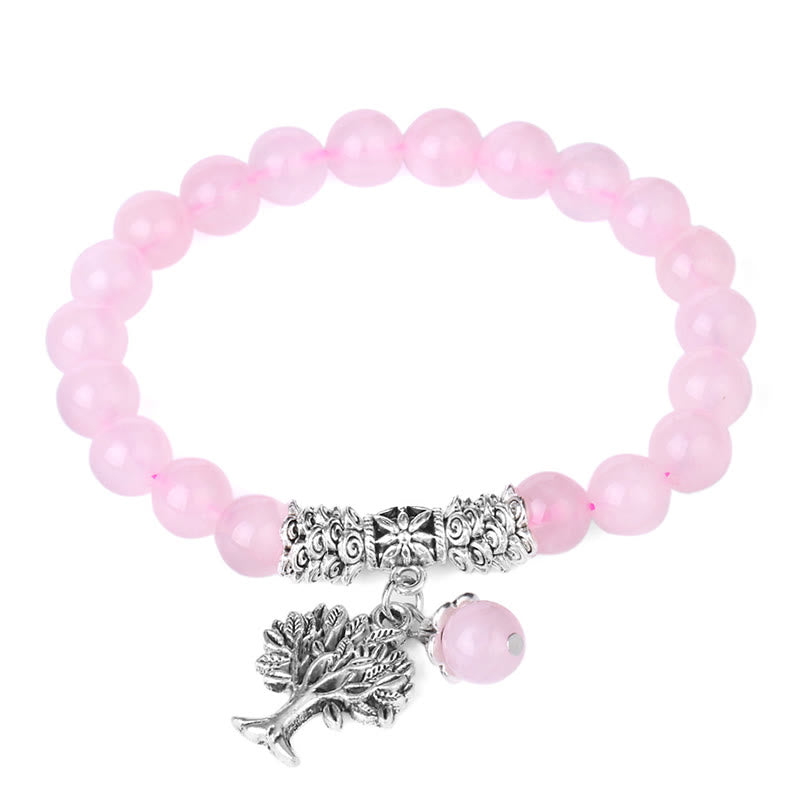 Tree of Life rose quartz bracelet with pale pink gemstone beads, silver Tree of Life pendant with leafy branches, pink bead dangle accent.