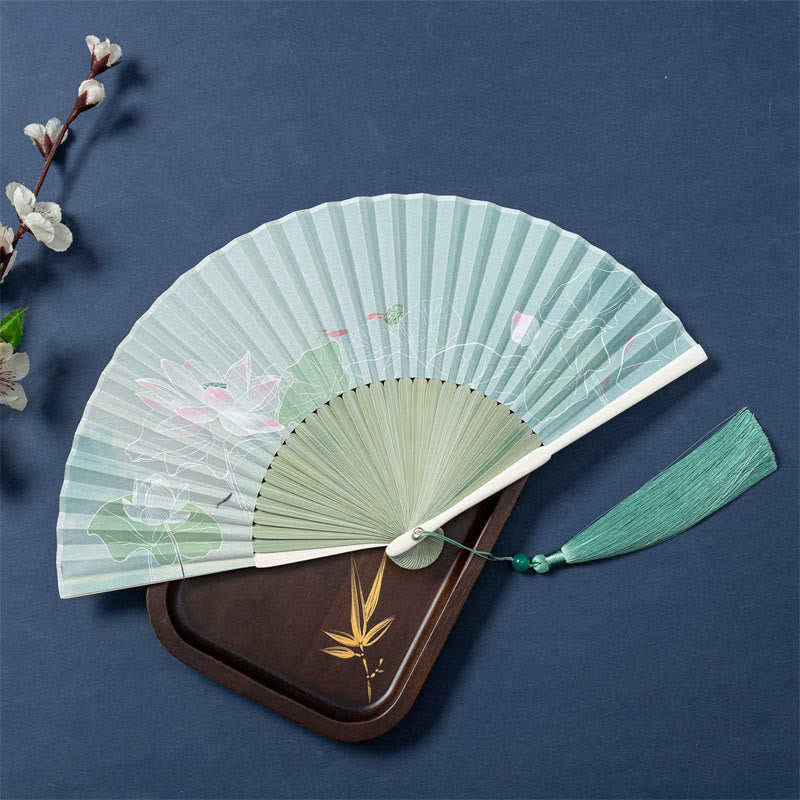Lotus Begonia Jasmine Handheld Bamboo Folding Fan - open fan showing lotus blooms, sage green tassel and bead