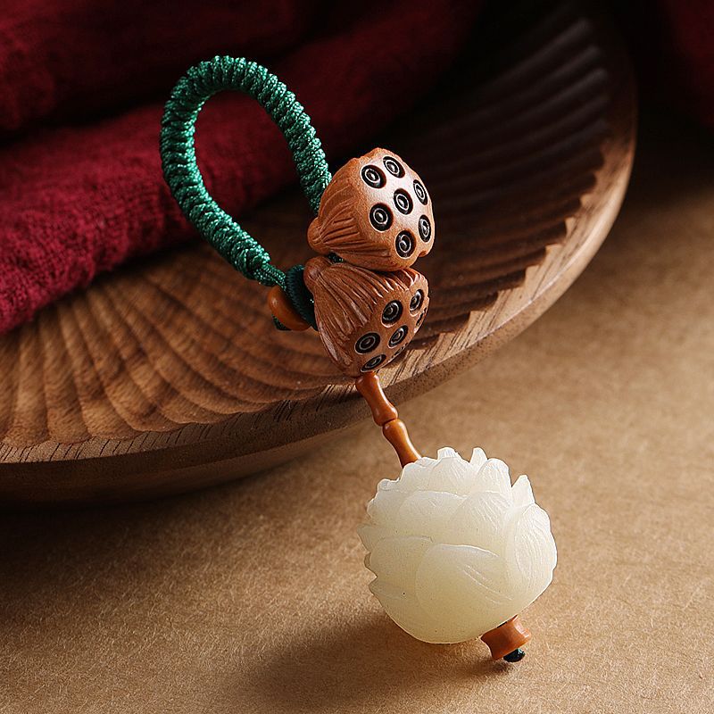 Bodhi Seed Peach Wood Lotus Keychain – Carved lotus flower pendant with wooden seed pods on green braided cord, bodhi seed keychain