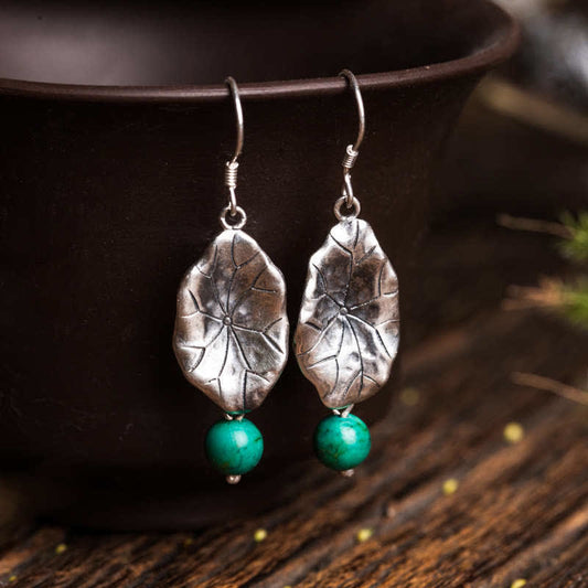 Sterling Silver Turquoise Lotus Leaf Earring - pair on ceramic vessel, nature-inspired