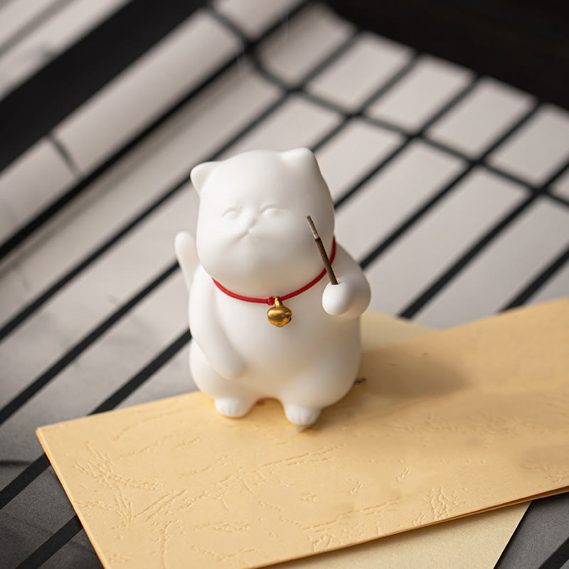 Mini Cute Cat Ceramic Incense Burner – White cat holding incense on embossed paper, minimalist Japanese-style decor