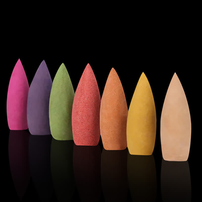 Mixed Scent Backflow Cones - Seven colorful cones in a row on black, purifying