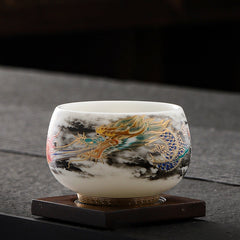 Dragon Playing Pearl Porcelain Teacup – Turquoise and blue dragon coiled through clouds on wooden stand, ceremonial gongfu