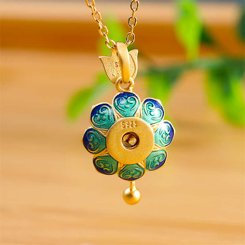 Red Agate Lotus Pendant – eight-petal enamel design with gold cloud spirals, elegant