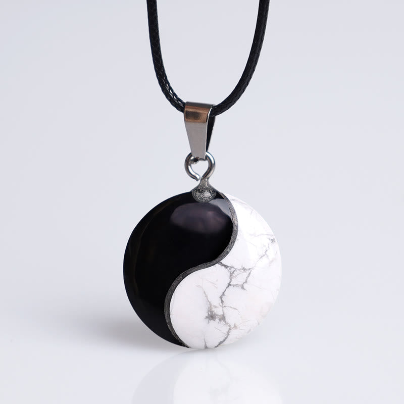 Black Obsidian White Turquoise Yin Yang Transformation Necklace Pendant - White howlite obsidian yin-yang on black cord, stud