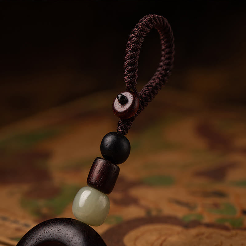 Tibetan Om Mani Padme Hum Sandalwood Cinnabar Protection Keychain – cord and jade bead top detail, sandalwood keychain