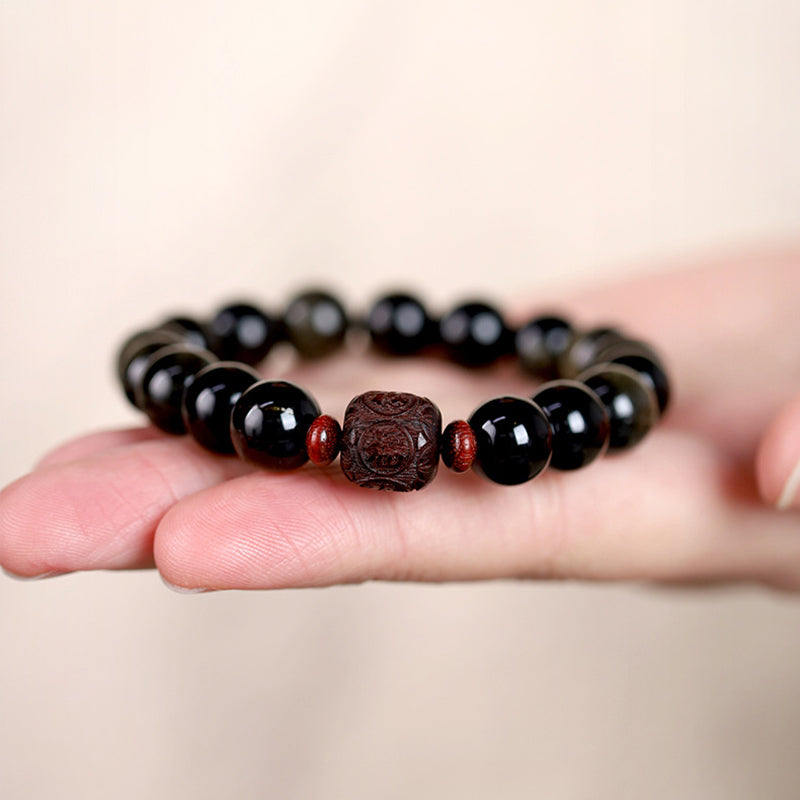 Gold Sheen & Rainbow Obsidian Fu Bracelet – on warm wooden surface with soft bokeh, obsidian bracelet