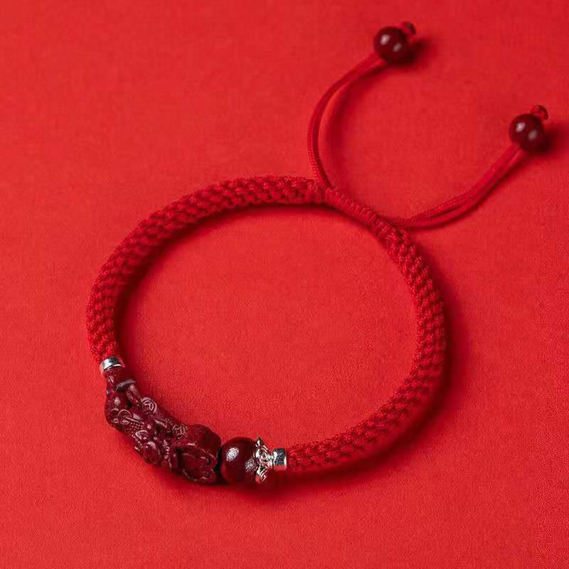 Handcrafted PiXiu Cinnabar Wealth Luck Braided Bracelet – adjustable style flat lay on red background, easy wear