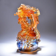 Liuli Crystal Dragon Art - Coiled dragon clutching flaming pearl with blue cloud base, handcrafted