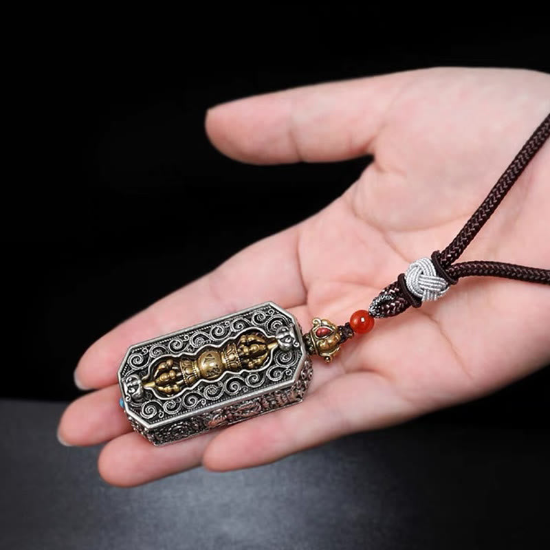 Dorje Vajra Rope Pendant – Resting on palm with endless knot cord, intricate silver filigree, zen necklace