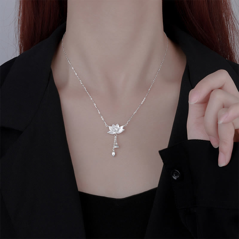 999 Silver Lotus Pod Necklace – Lotus pendant on model in black blouse, wear shot, silver spiritual necklace
