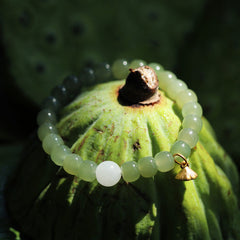 Jade Lotus Abundance Bracelet – Pale celadon beads with white jade accent on green lotus pod, prosperity jade