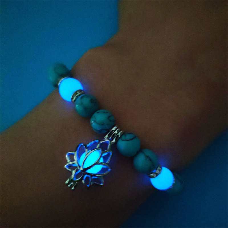 Tibetan Turquoise Glowstone Lotus Bracelet – turquoise beads with cyan glow on wrist showing lotus charm, glow bracelet