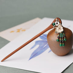 Red Sandalwood Green Agate Hairpin, wooden hairpin with gold ginkgo leaf on ceramic vase background