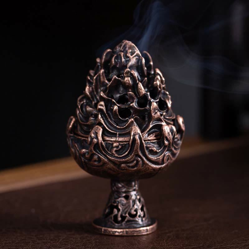 Copper Alloy Incense Censer – Three-quarter front view on dark wood with smoke from mountain lid, dramatic rim lighting