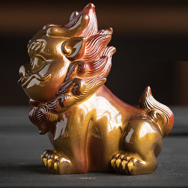 Small PiXiu Tea Pet – Side close-up of gold PiXiu on black surface, detailed curly mane