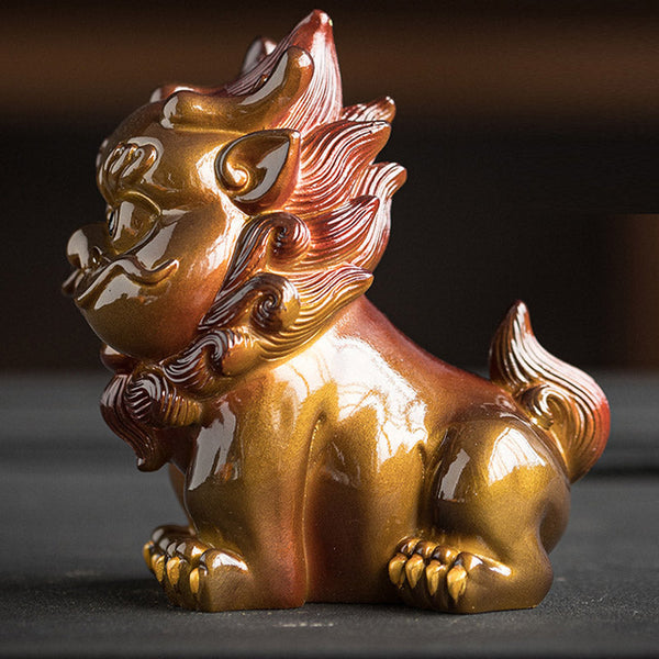 Small PiXiu Tea Pet – Side close-up of gold PiXiu on black surface, detailed curly mane