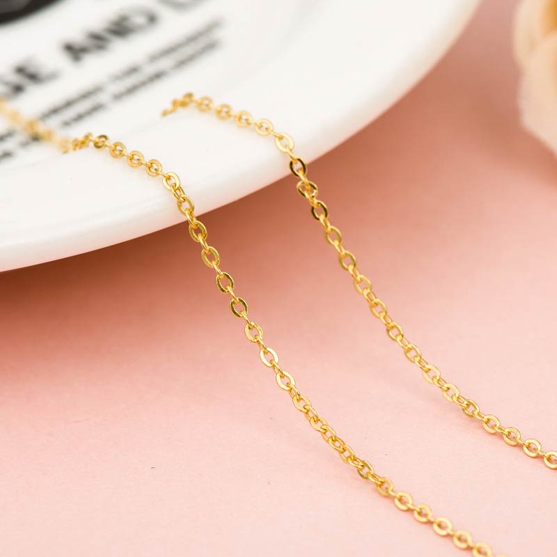 White Jade Buddha Success Pendant Necklace – Delicate gold cable chain on ceramic dish, chain detail, feminine elegance