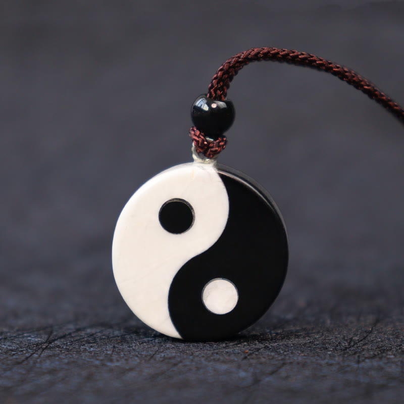 Black Obsidian White Turquoise Yin Yang Strength Fulfilment Necklace Pendant - Polished obsidian howlite yin-yang on maroon c