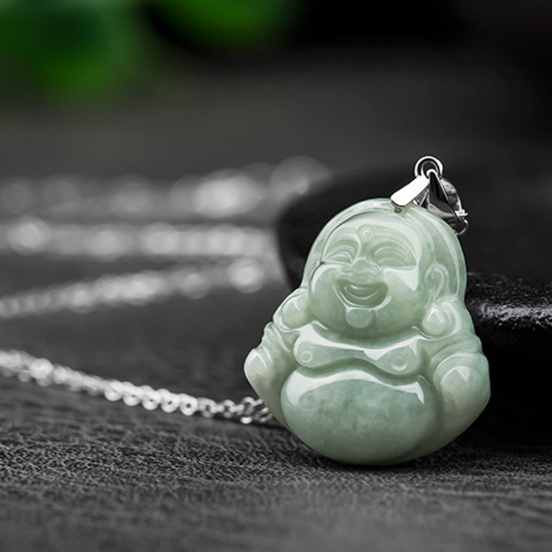 Jade Laughing Buddha Blessing Necklace – low angle on slate, green bokeh backdrop, carved details, fortune
