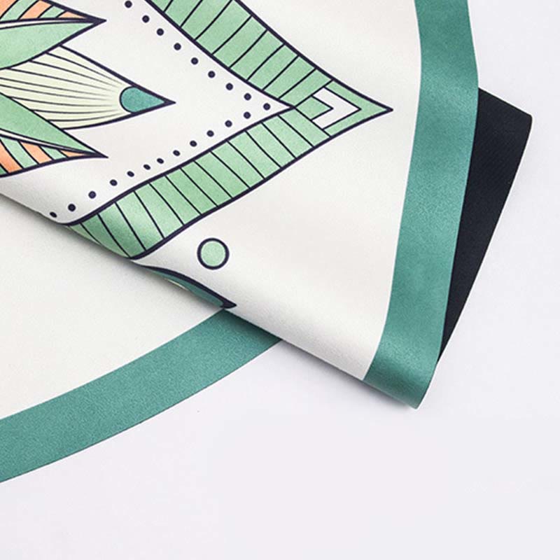 Tibetan Lotus Mandala Yoga Mat hands folding green mandala fabric, demonstrating drape and lightweight texture, boho style
