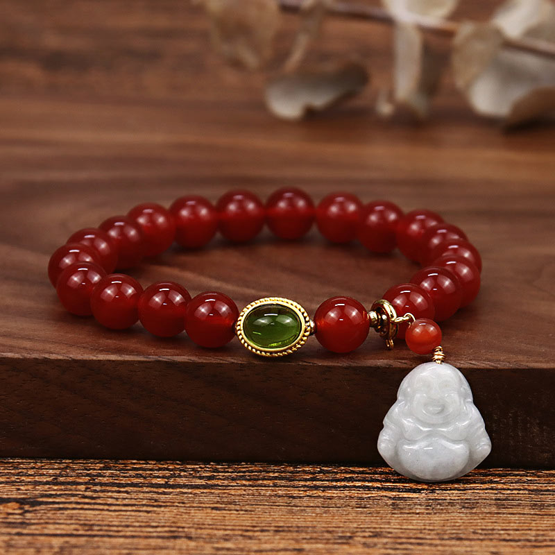 Red Agate Buddha Bracelet - Full view on wood with white Buddha charm, green gem accent