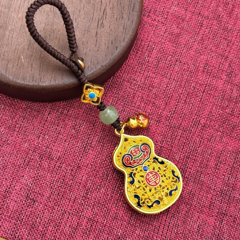 Gold enamel calabash keychain with jade bead and small gourd charm, thin brown cord