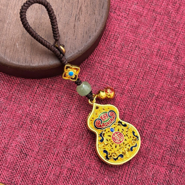 Gold enamel calabash keychain with jade bead and small gourd charm, thin brown cord