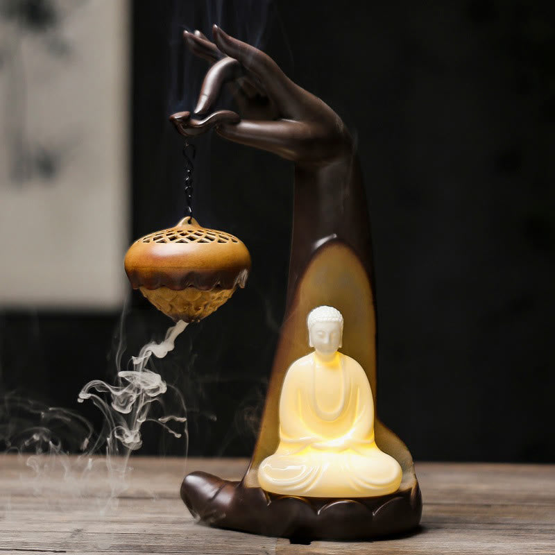LED Buddha Hand Backflow Burner - illuminated Buddha figure with cascading smoke, dark setting