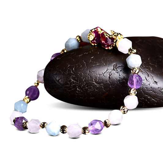 Natural Amethyst Pixiu Bracelet – on black stone side view, white background amethyst pixiu bracelet colorful beads