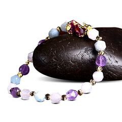 Natural Amethyst Pixiu Bracelet – on black stone side view, white background amethyst pixiu bracelet colorful beads