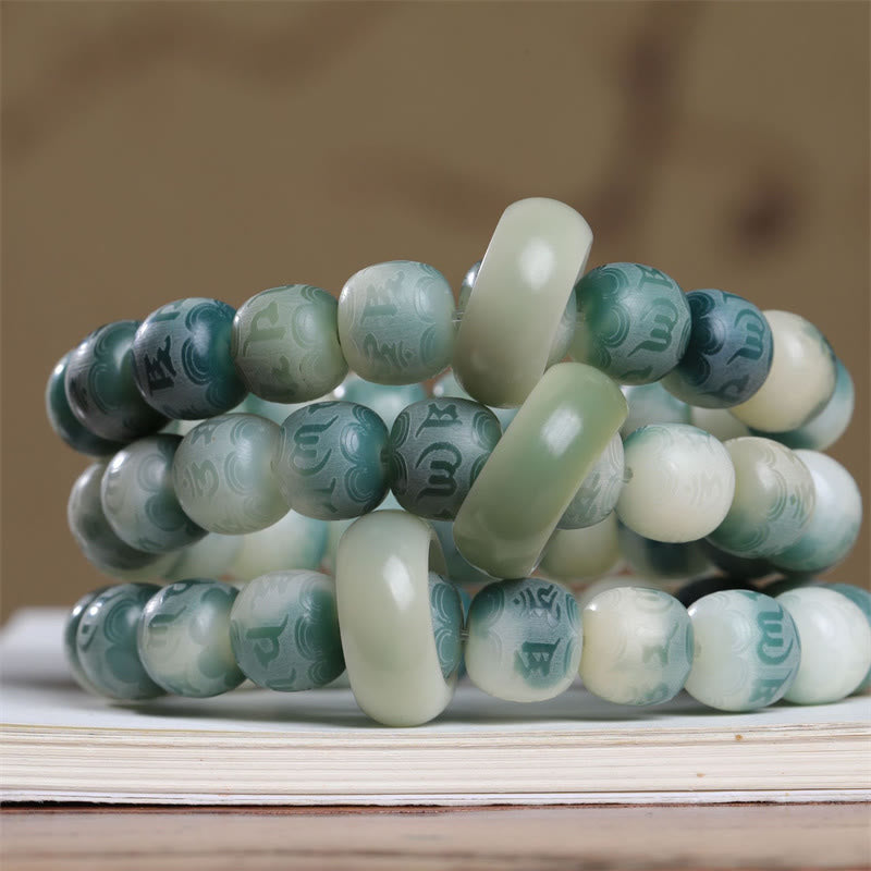 Bodhi Seed Om Mani Padme Hum Bracelet – Three stacked bracelets showing carved mantra beads and spacer elements