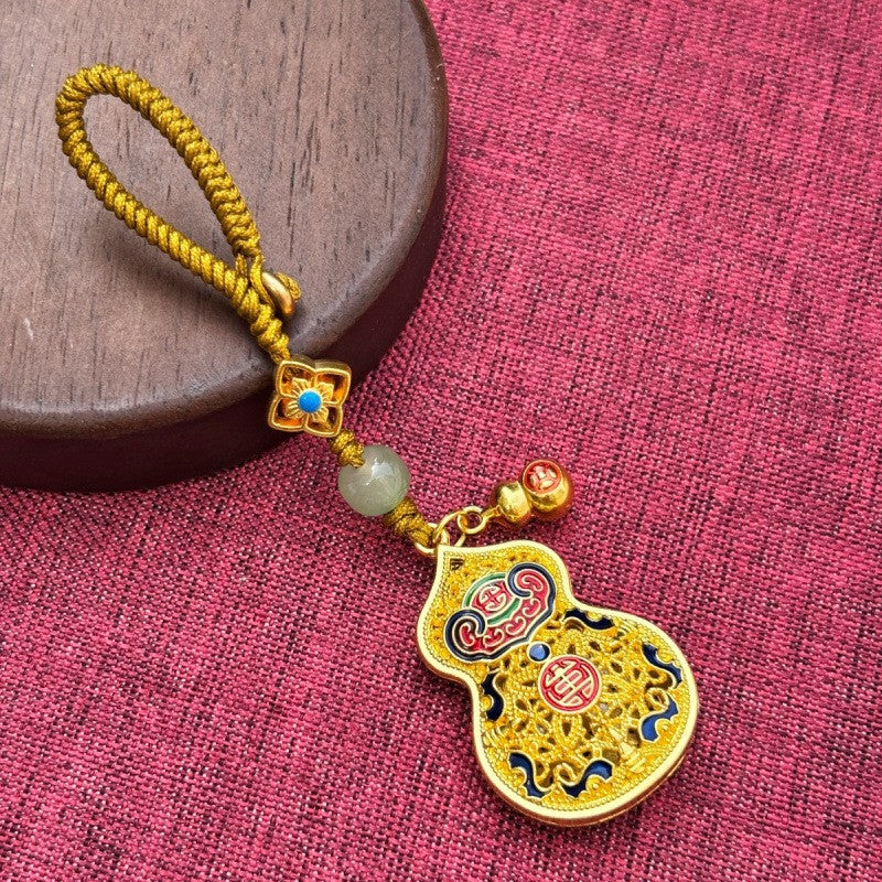 Gold enamel calabash keychain with ruyi cloud pattern, jade bead and gold twisted cord