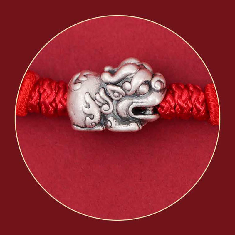 925 Silver PiXiu Fu Bracelet – Close-up of silver PiXiu charm on red cord, circular frame