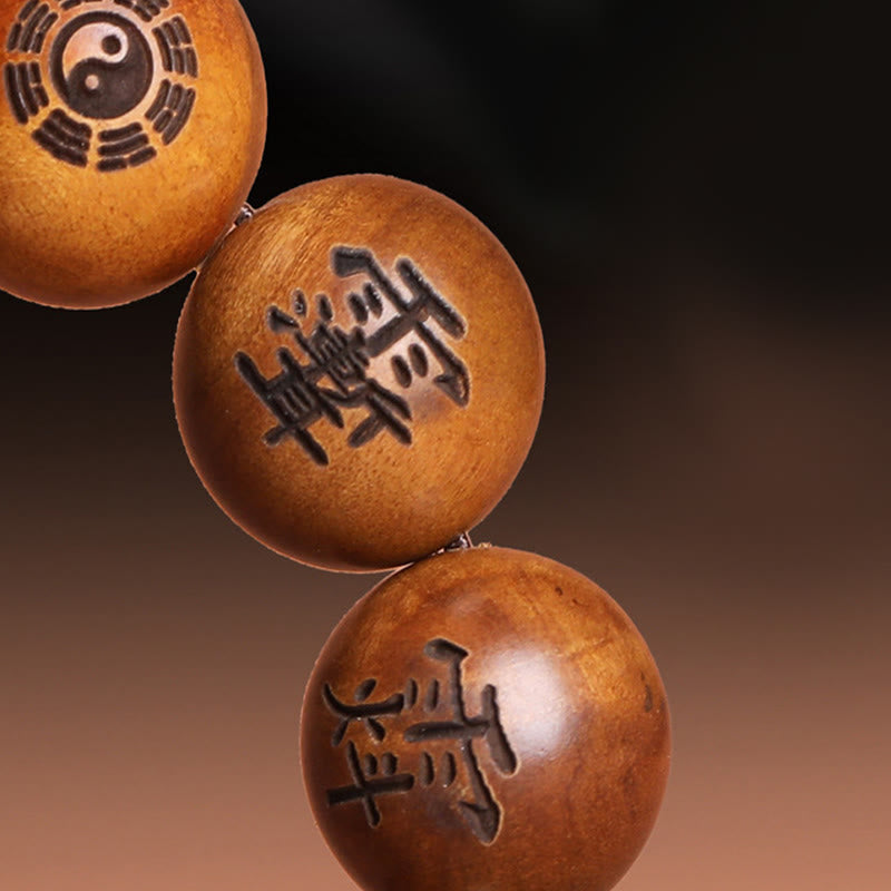 Lightning Struck Jujube Wood Taoist Bracelet - Macro shot of three wood beads with Bagua trigram and seal script, detail wood carving