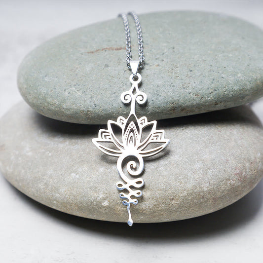 Lotus Luck Wealth Titanium Necklace – silver openwork lotus on stacked river pebbles, new beginnings