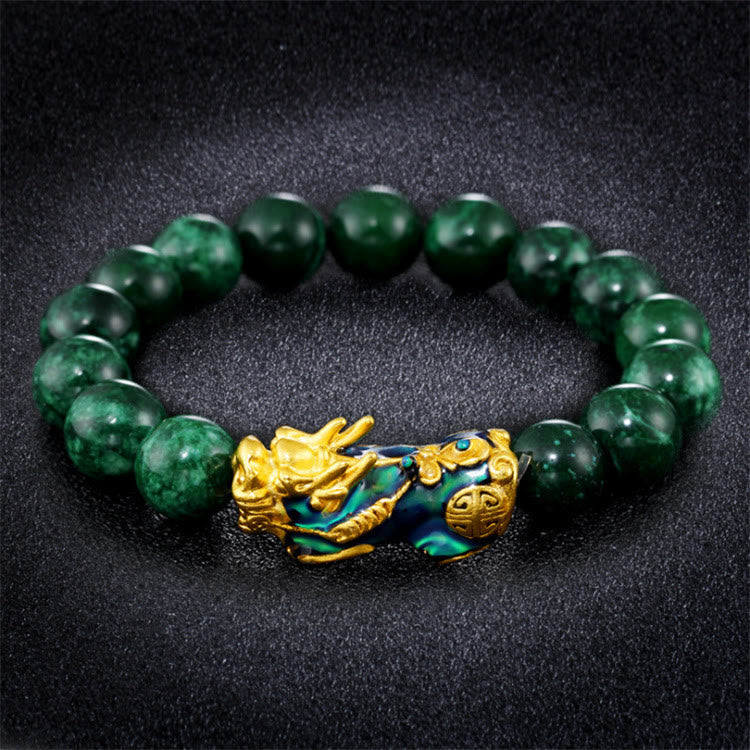 Jade Pixiu Bracelet – Green jade bracelet with gold-green PiXiu on black textured background, prosperity protection