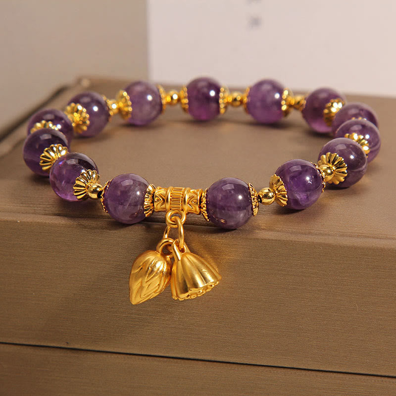 Natural Amethyst Lotus Healing Bracelet - purple amethyst beads gold spacers on wooden surface, grounding