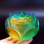 Lotus Liuli Incense Burner - teal-to-gold lotus held in palm, serene