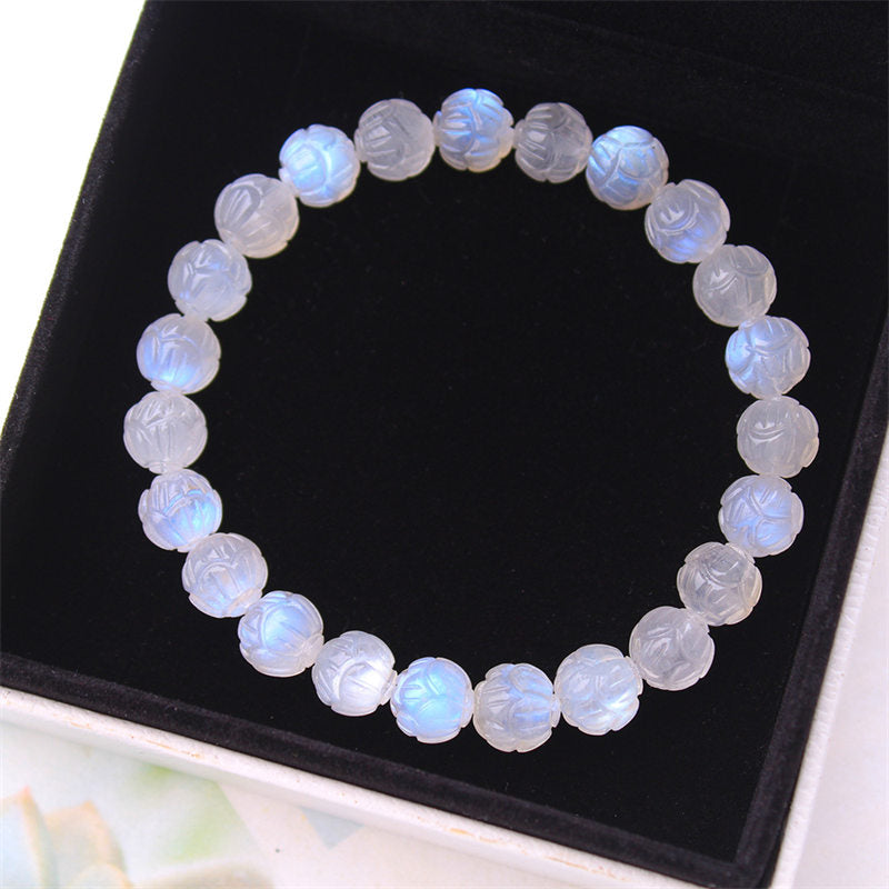 Natural Moonstone Lotus Love Bracelet - flat lay in black tray with box, moonstone beads